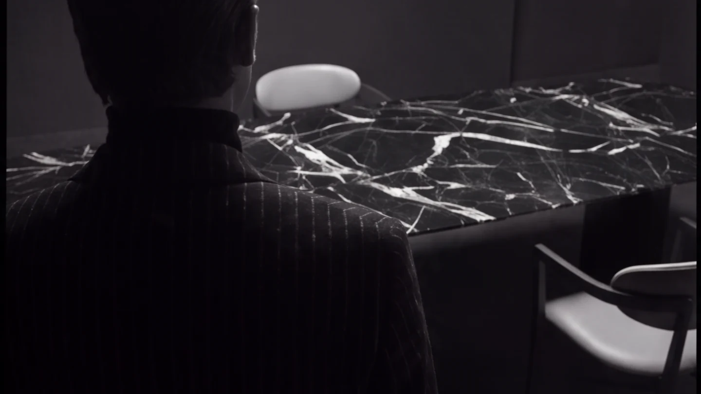 A Terra Vein dining table in Nero Marquina marble
