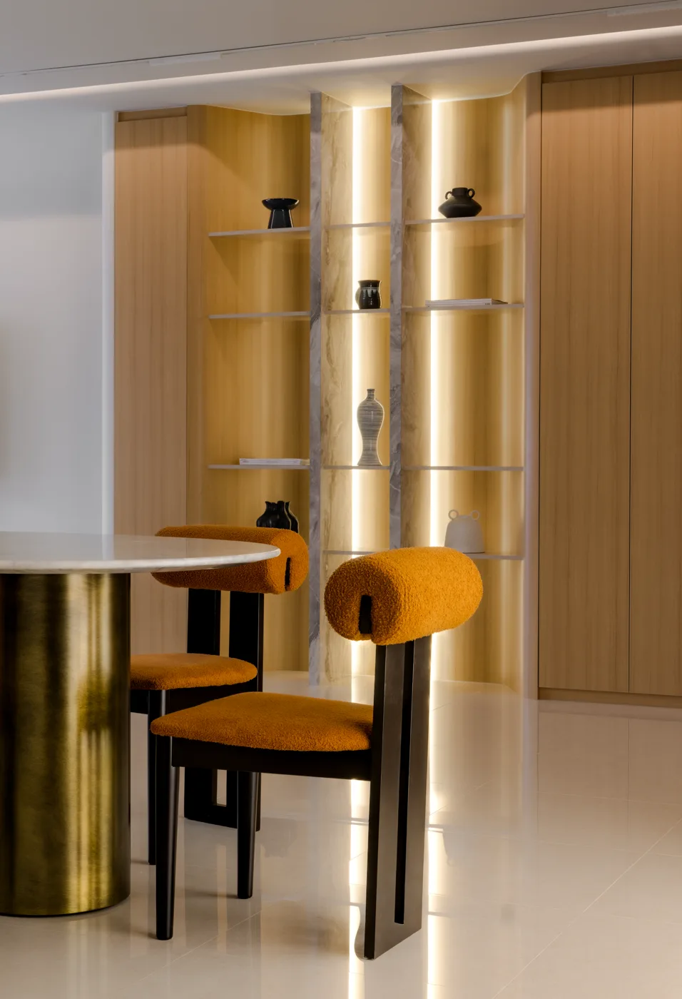 A Stellato Bianco table seen across a warm-toned dining room